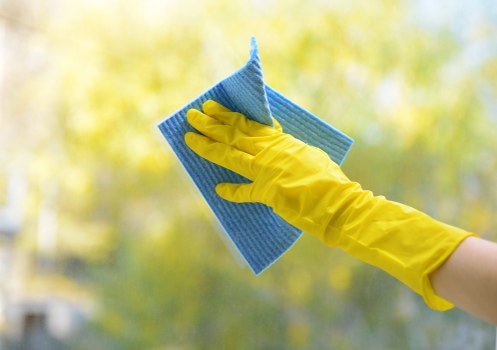 Cleaner preparing a home cleaning checklist for a TW8 property